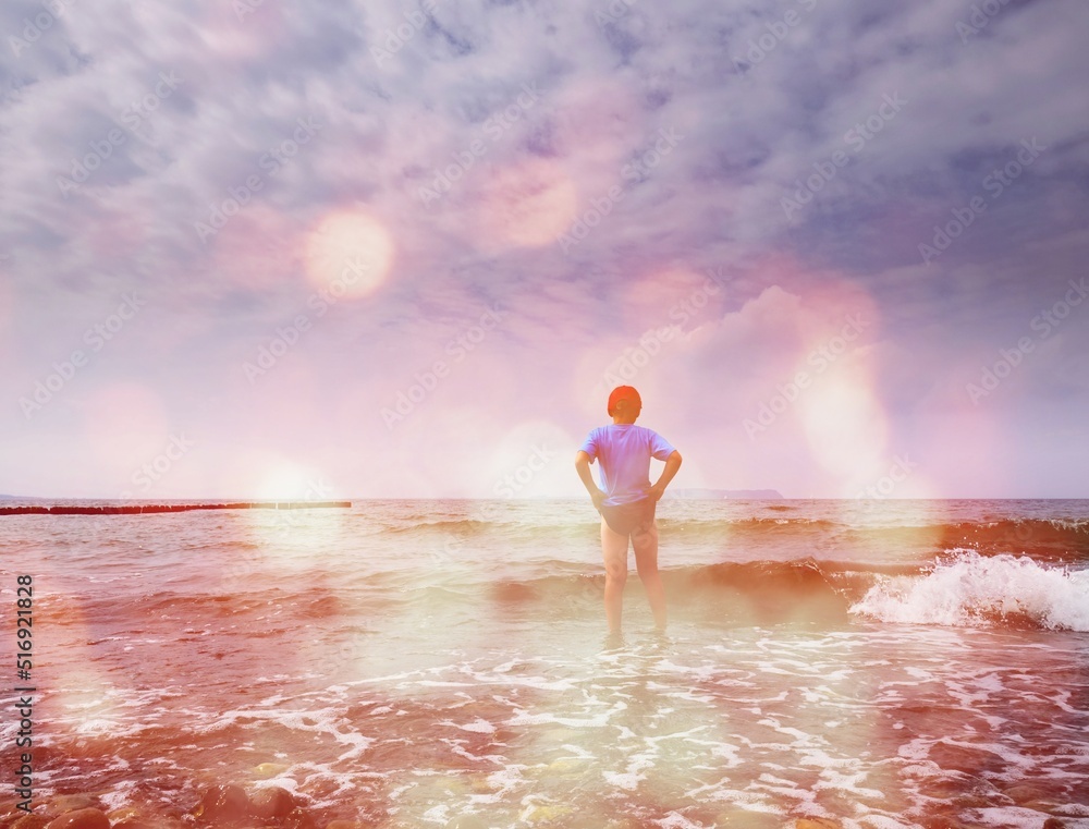 Boy Stay In Cold Water At Sea Shore. Cold Water Waves Washing Hisd