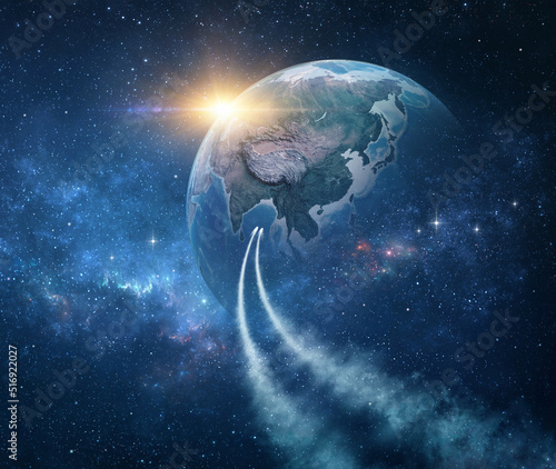Spaceships, space probes traveling through galaxy, returning planet Earth, sun rising behind. Comets in outer space reaching the Earth. 3D illustration - Elements of this image furnished by NASA