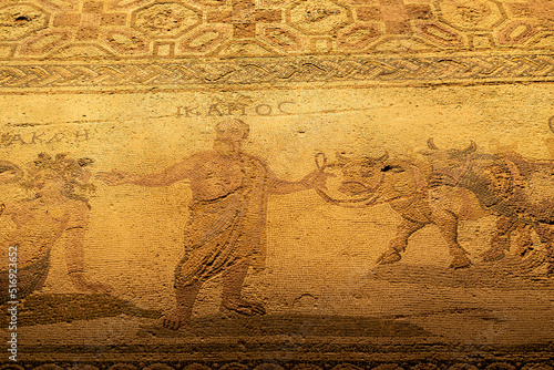 Ancient Greek floor mosaic in archaeologic park Kato Paphos, Cyprus.