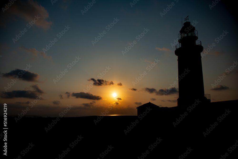 Beautiful sunset at the lighthouse of Kato Paphos coastline.