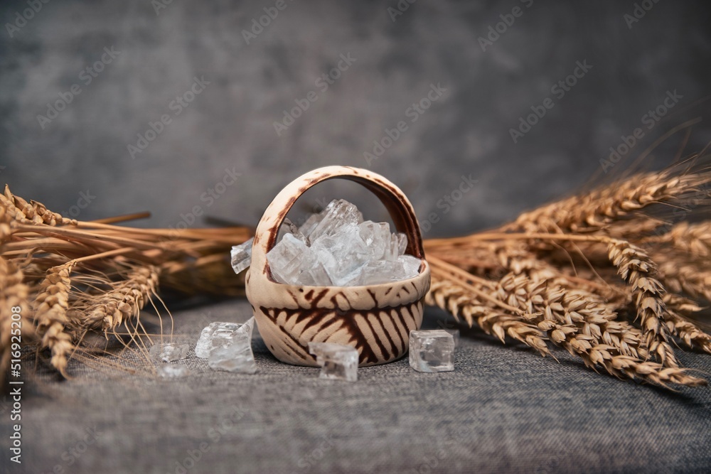 Wheat and salt on grey stone background. Traditional Ukrainian dish