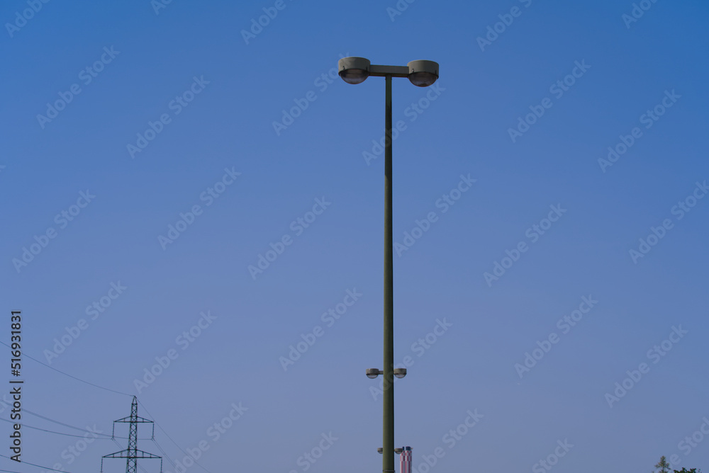 Light pole at highway at commune Wallisellen near City of Zürich with heavy traffic on a sunny summer day. Photo taken June 18th, 2022, Wallisellen, Canton Zurich, Switzerland.