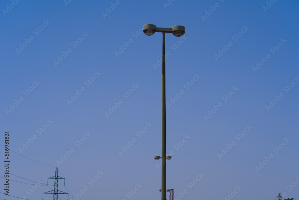 Light pole at highway at commune Wallisellen near City of Zürich with heavy traffic on a sunny summer day. Photo taken June 18th, 2022, Wallisellen, Canton Zurich, Switzerland. Light pole at highway at commune Wallisellen near City of Zürich with heavy traffic on a sunny summer day. Photo taken June 18th, 2022, Wallisellen, Canton Zurich, Switzerland.