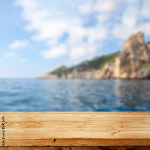 Desk of free space and summer landscape of sea 