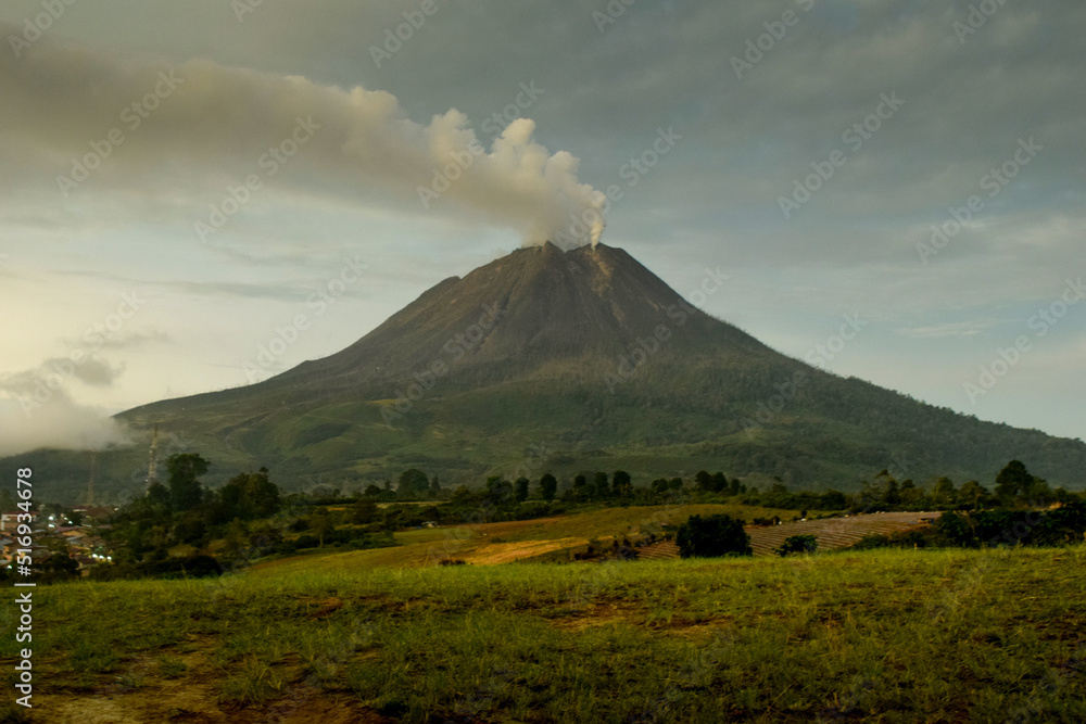 Mount Sinabung - Located in Kabanjahe, Karo Regency.
This mountain is still actively emitting hot clouds until now.