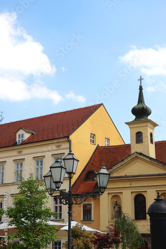 Colorful historical buildings and vintage street lantern in central Zagreb, Croatia.