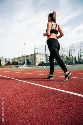 Pregnancy fitness. Prenatal healthy fitness active fit gym outside. Pregnant woman training yoga sport exercise. Prenatal Gymnastics. © Maksym