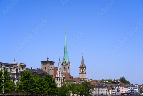 Medieval old town of Zürich with church towers of Women's Minster and St. Peter on a sunny hot summer day. Photo taken June 19th, 2022, Zurich, Switzerland.