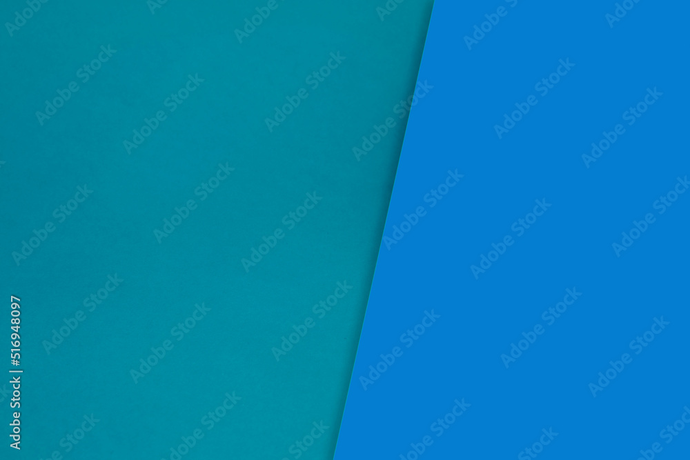 Dark vs light abstract Background with plain subtle smooth de saturated blue colours parted into two	