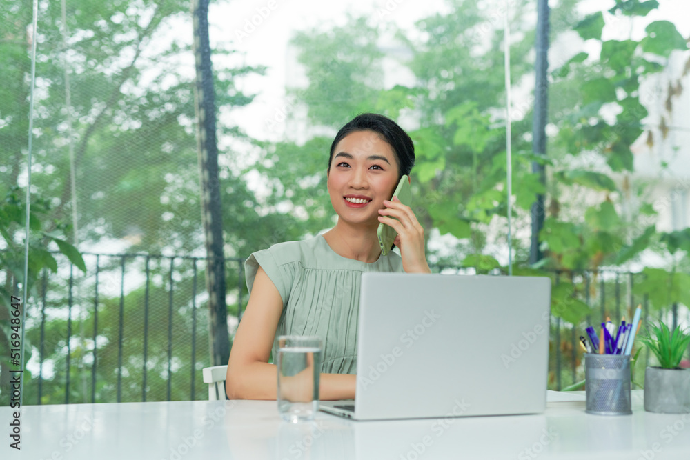Informal Call. Happy young woman in glasses calling her friend, talking and asking about something, using laptop Informal Call. Happy young woman in glasses calling her friend, talking and asking about something, using laptop