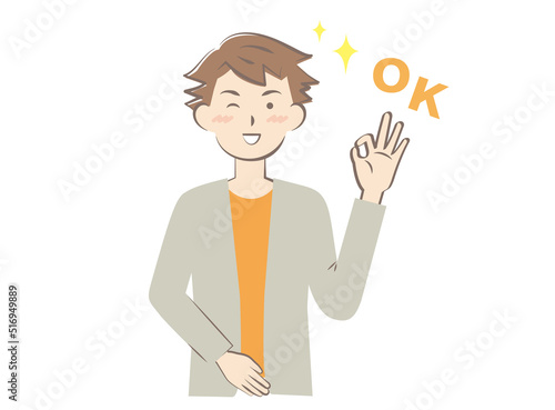 OKサインを出す若い私服の男性