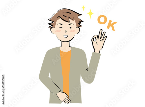 OKサインを出す若い私服の男性