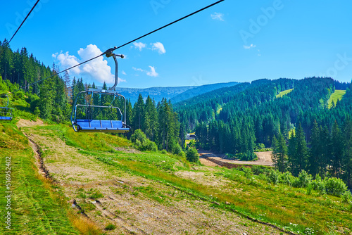 The chairlift ride, Bukovel, Carpathians, Ukraine photo