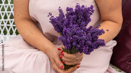 Woman with bouquet of beautiful lavender flowers outdoors  closeup.