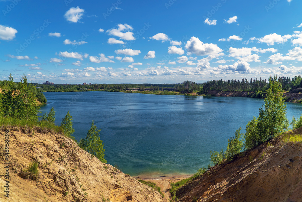 On the shore of the Pugarevsky quarry . Summer landscape. Leningrad region. Vsevolozhsk.