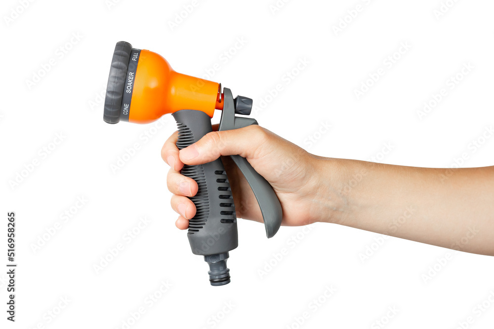 Garden spray gun in hand on a white background. Garden accessories Garden spray gun in hand on a white background. Garden accessories