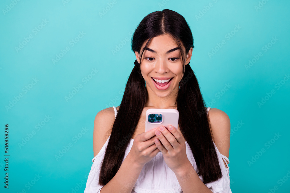 Photo of surprised millennial lady blogging network gadget web sale isolated on aquamarine color background Photo of surprised millennial lady blogging network gadget web sale isolated on aquamarine color background