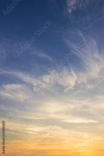 Fototapeta Naklejka Na Ścianę i Meble -  Sunset sky clouds vertical in the evening on summer season with orange, yellow, sunlight on blue sky background 