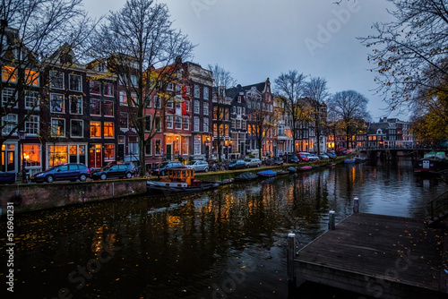 Beautiful houses at the canal at night in Amsterdam