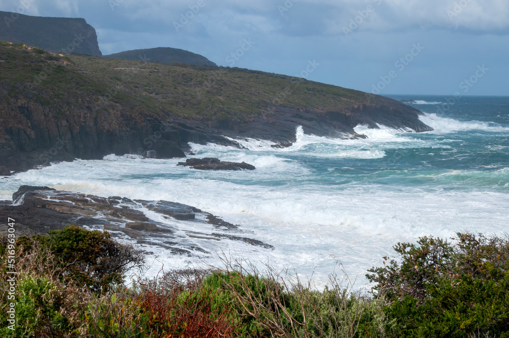 Maingon Bay Australia, waves breaking along coastline Maingon Bay Australia, waves breaking along coastline