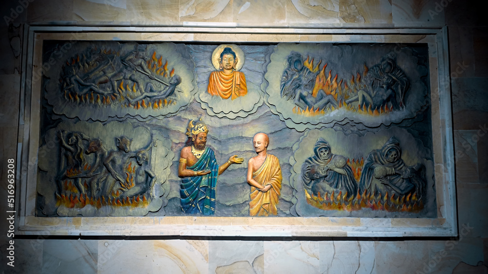 A painting on a wall in a Buddhist temple with a buddha and the history of his arrival and life. A painting on a wall in a Buddhist temple depicting hell. Torment of sinners. 