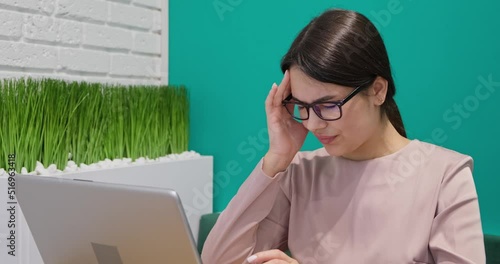 Young business woman has a headache