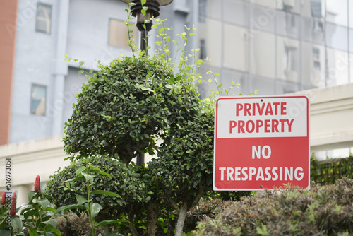 фотографія Private Property No trespassing text and buildings