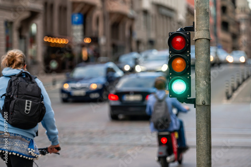 Obraz na płótnie view of city traffic with traffic lights, in the foreground a semaphore with a g