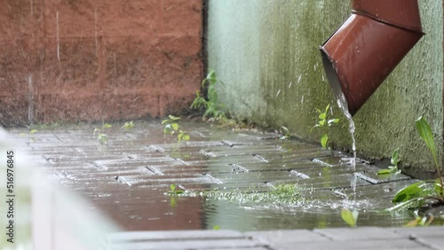 bad weather in the summer it rains water flows into the gutter