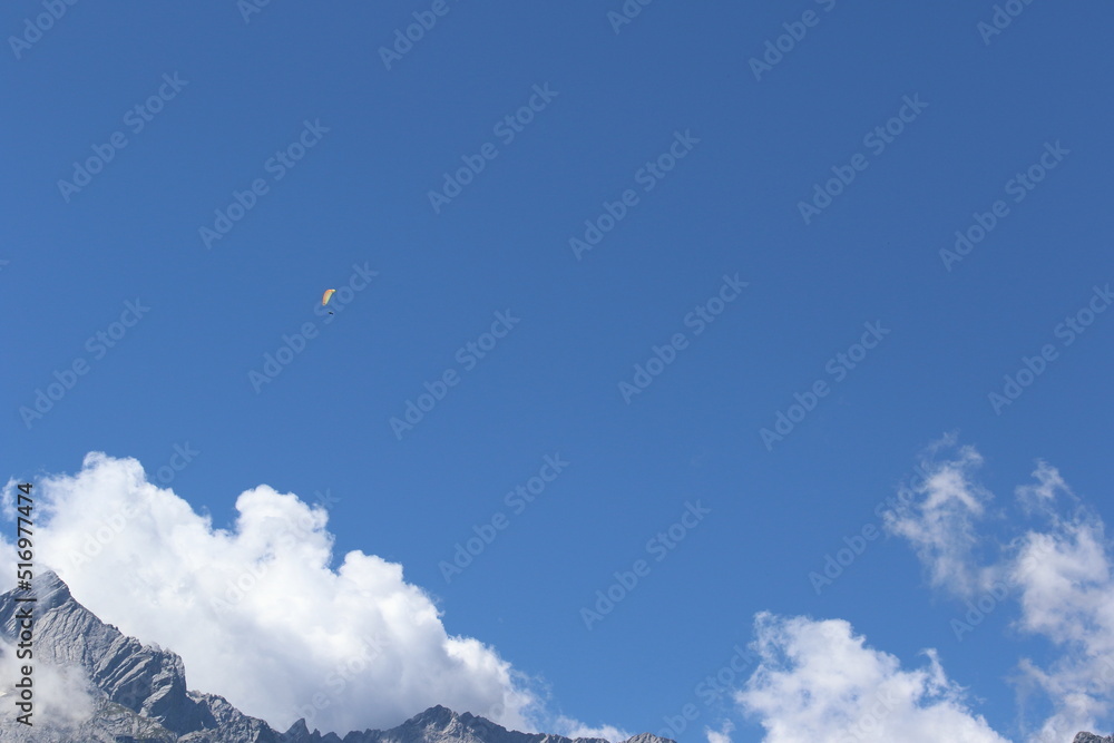 paragliding over clouds in bavaria, germany paragliding over clouds in bavaria, germany