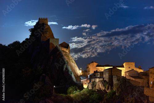 Photos in the historic center of Sperlinga with its castle in the moonlight on a clear