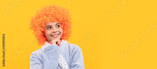 good morning. childhood happiness. birthday or pajama party. funny kid in curly clown wig. Funny teenager child on party, poster banner header with copy space.