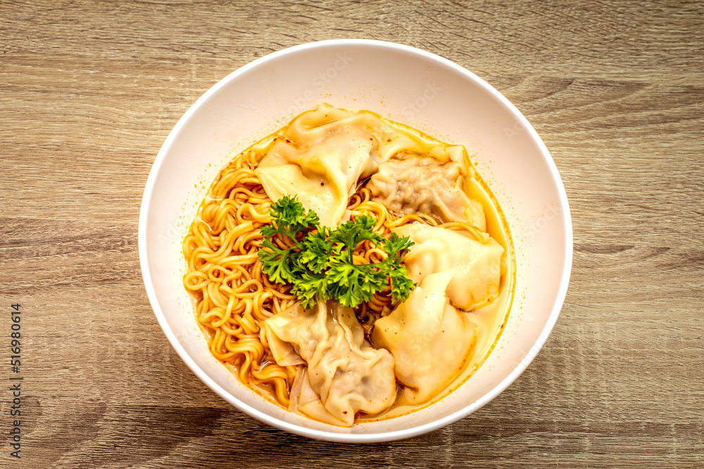 Egg noodles with pork wonton soup or pork dumplings soup and vegetable. Asian food style Egg noodles with pork wonton soup or pork dumplings soup and vegetable. Asian food style