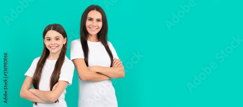 Mother and daughter child banner, copy space, isolated background. mother and daughter in white shirt. happy childhood and motherhood. concept of friendship. © Olena