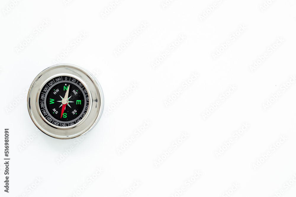 Direction choice concept with compass close up