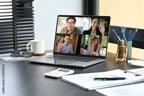 An Opening video conference screen of laptop computer place on the office desk, Online meeting concept.