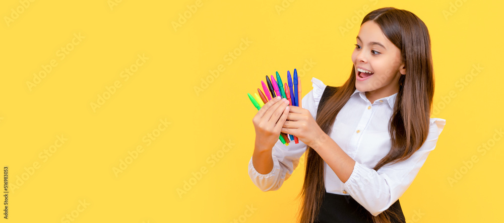 Happy girl child hold felt-tips yellow background, school stationery. Banner of school girl student. Schoolgirl pupil portrait with copy space. Happy girl child hold felt-tips yellow background, school stationery. Banner of school girl student. Schoolgirl pupil portrait with copy space.
