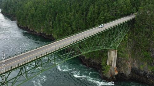 Drone shot of camping vehicles leaving the Deception Pass State Park. photo