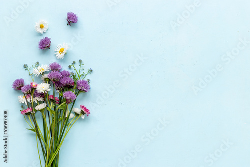 Summer floral background with wild meadow flowers and herbs