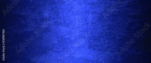 Blue abstract lava stone texture background, dark blue rough grainy stone or concrete wall texture background, Blue background with faint texture and bright center and black vignette border.