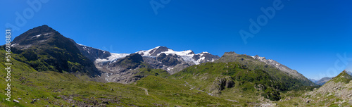 Beautiful wide angle mountain panorama at Swiss mountain pass Susten on a sunny summer day. Photo taken July 13th, 2022, Susten Pass, Switzerland.