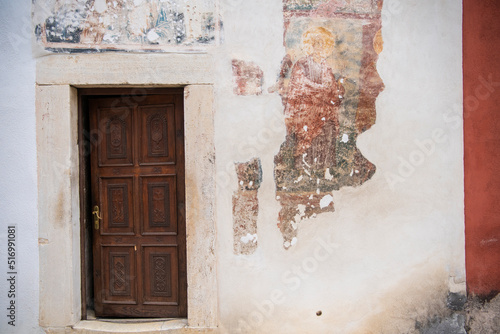 Old Wooden door to Medieval Monastery and Church Pecka Patrijarsija, main Serbian orthodox monastery and patriarchate. UNESCO world heritage site in Pec, Kosovo, Serbia 05.03.2022 photo