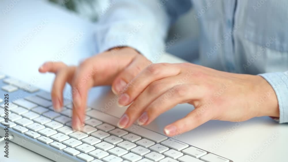 Female hands busy working on computer keyboard for sending emails and surf on a web browser Female hands busy working on computer keyboard for sending emails and surf on a web browser