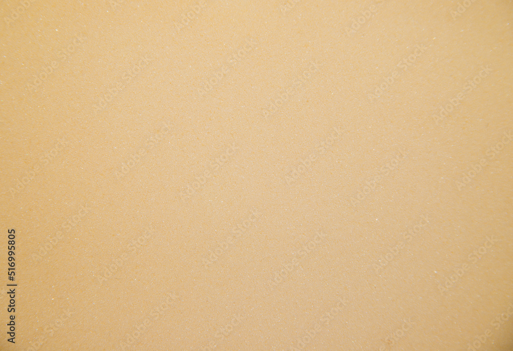 Abstract background made of foam sponge of light yellow color. Uneven surface.Texture. Abstract background made of foam sponge of light yellow color. Uneven surface.Texture.