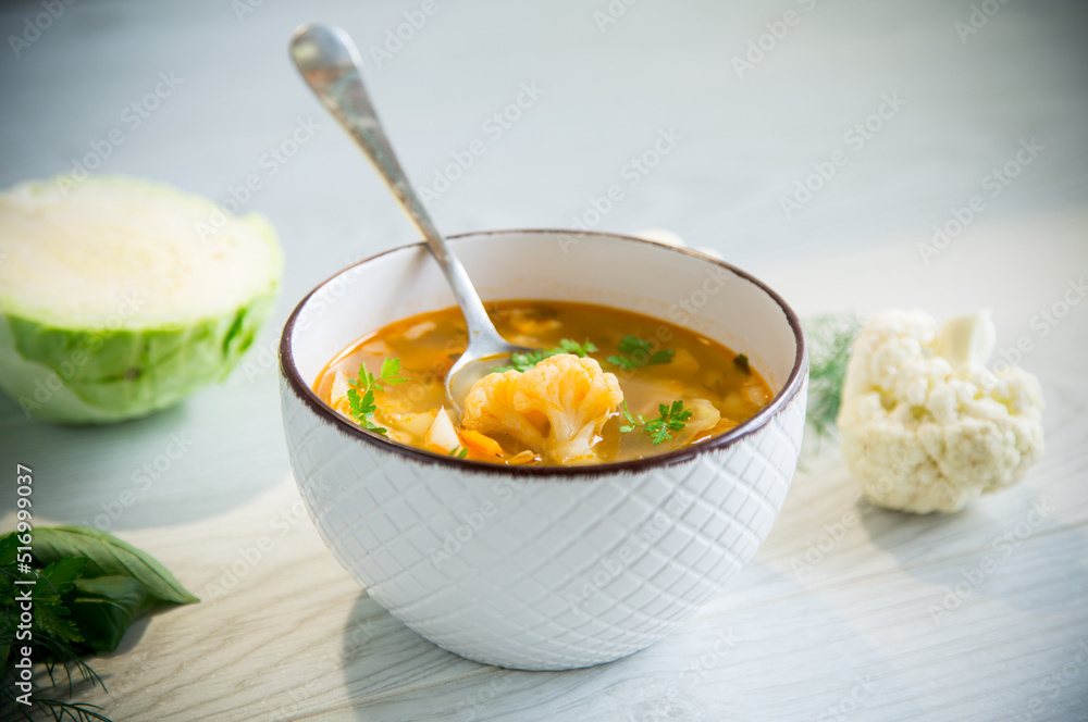 vegetable summer soup with cauliflower in a bowl vegetable summer soup with cauliflower in a bowl