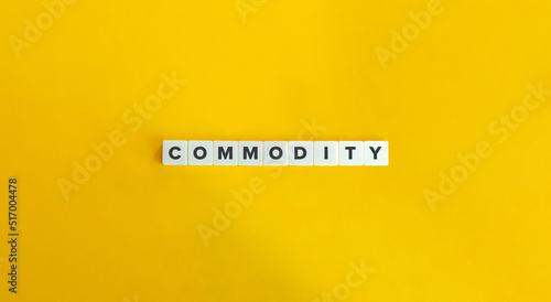 Commodity Word on Block Letter Tiles on Yellow Background. Economics Banner. Minimal Aesthetics.