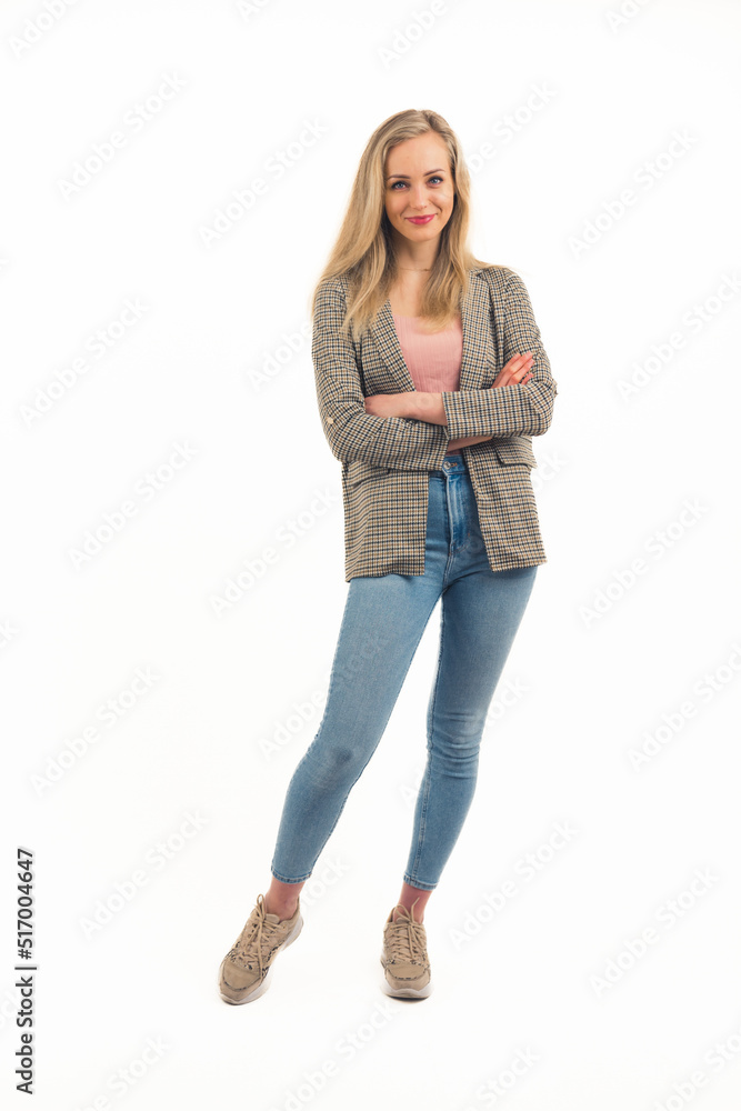 Vertical studio isolated copy space shot of a young blond caucasian semi-formally dressed woman with crossed arms standing and looking at camera with a smile on her face. Full body. High quality photo Vertical studio isolated copy space shot of a young blond caucasian semi-formally dressed woman with crossed arms standing and looking at camera with a smile on her face. Full body. High quality photo