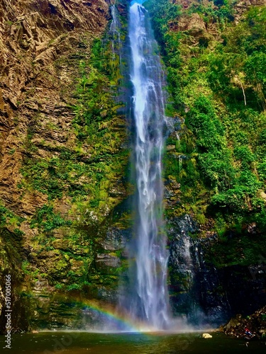 Vertical shot of Wli waterfall in the forest in Ghana photo