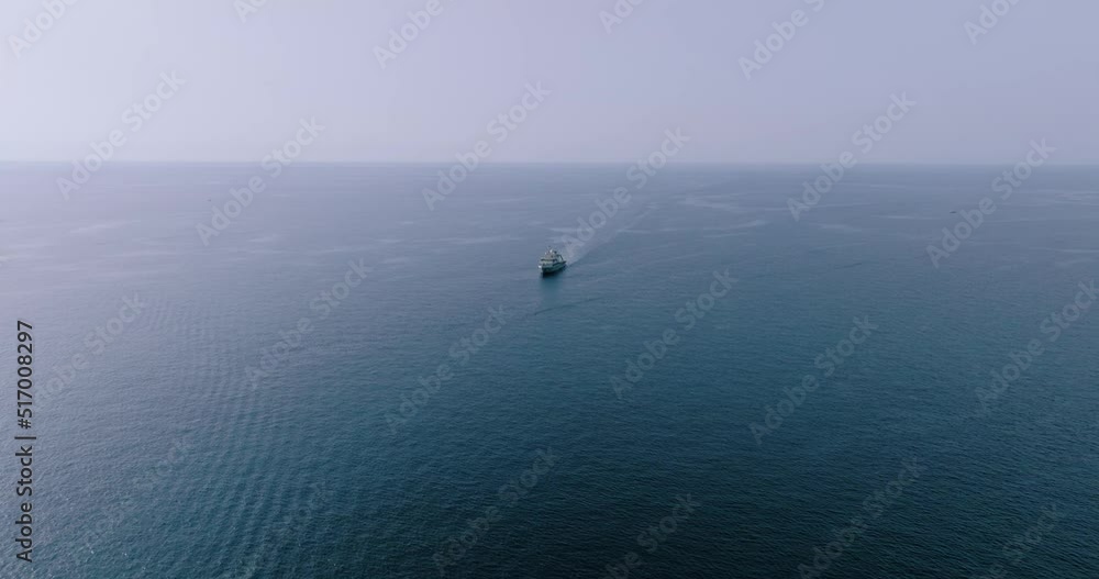 Aerial view of a boat that moves on the deep blue sea Aerial view of a boat that moves on the deep blue sea