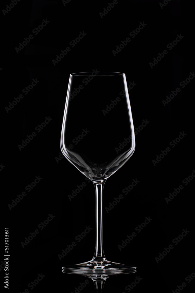 Glass goblet on black background